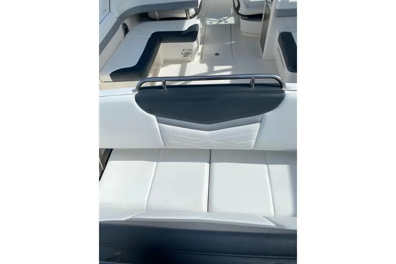 Slide: The Image of 2021 Robalo R317 Dual Console boat interior with white and black seating. - 22