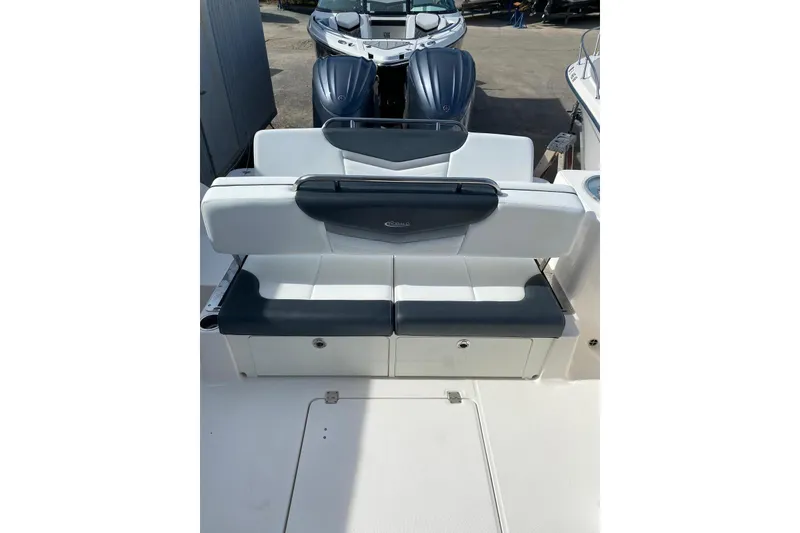 Slide: The Image of 2021 Robalo R317 Dual Console boat interior with seating and storage compartments. - 23