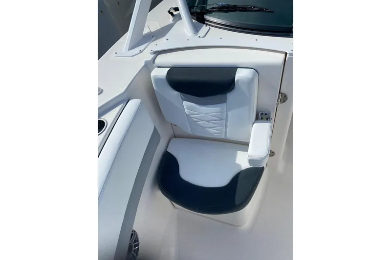 Slide: The Image of 2021 Robalo R317 Dual Console boat seat with white and black upholstery. - 24