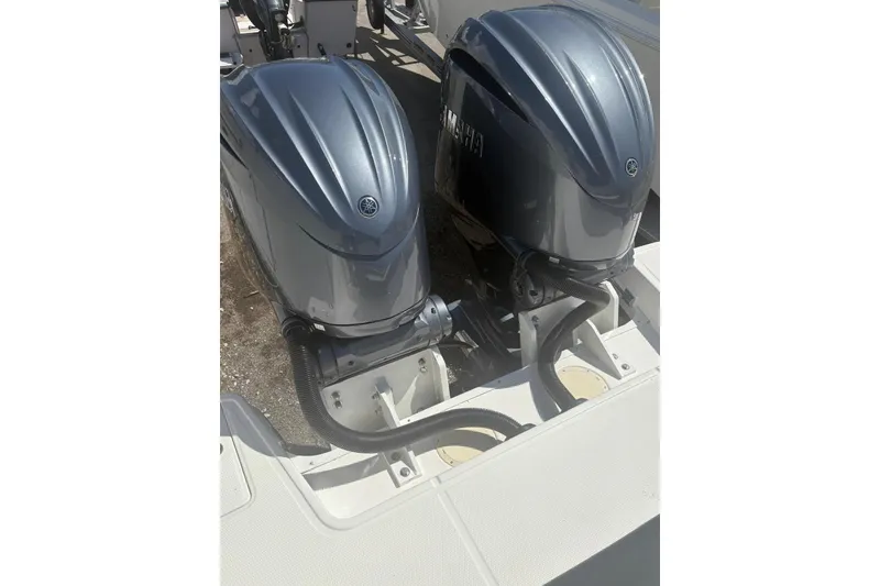 Slide: The Image of Twin Yamaha outboard engines on a 2021 Robalo R317 Dual Console boat. - 9