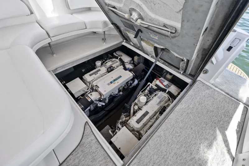 Slide: The Image of Engine compartment of 2001 Sea Ray 380 Sundancer yacht, showcasing dual engines. - 12