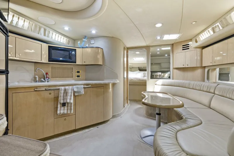 Slide: The Image of Luxurious interior of a 2001 Sea Ray 380 Sundancer yacht with modern amenities. - 16