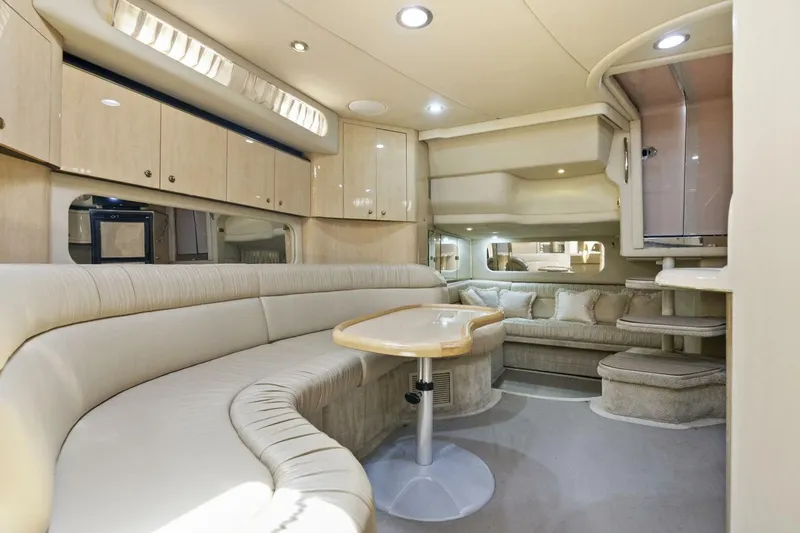 Slide: The Image of Luxurious interior of 2001 Sea Ray 380 Sundancer yacht with plush seating and modern amenities. - 18