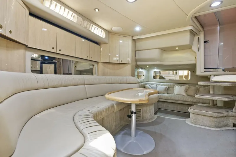 Slide: The Image of Luxurious interior of 2001 Sea Ray 380 Sundancer yacht with plush seating and elegant design. - 20