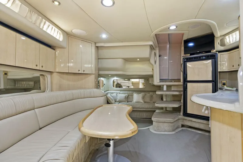 Slide: The Image of Luxurious interior of 2001 Sea Ray 380 Sundancer yacht with elegant seating and modern amenities. - 21