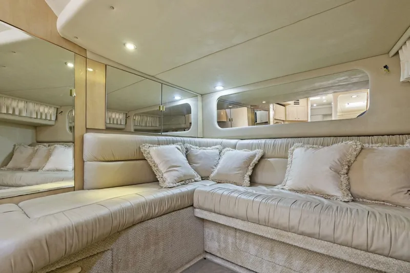 Slide: The Image of Luxurious interior of 2001 Sea Ray 380 Sundancer yacht with plush seating and elegant decor. - 22