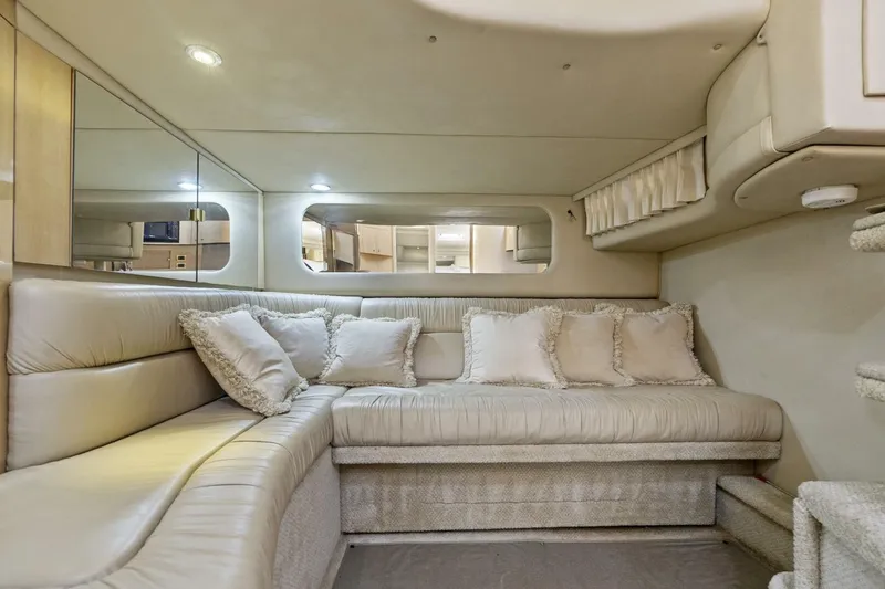 Slide: The Image of Luxurious interior of 2001 Sea Ray 380 Sundancer yacht with plush seating and elegant decor. - 24