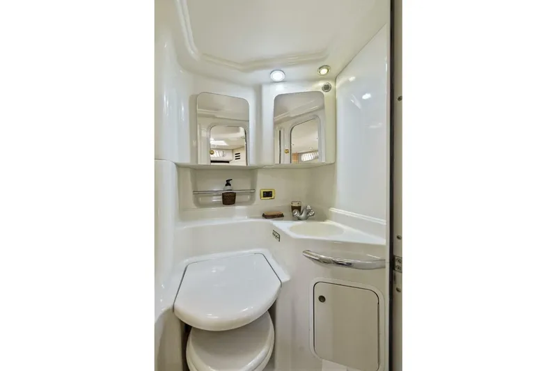 Slide: The Image of 2001 Sea Ray 380 Sundancer bathroom with modern fixtures and compact design. - 26