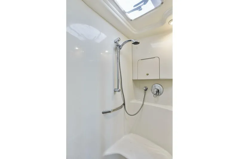 Slide: The Image of Shower area in 2001 Sea Ray 380 Sundancer yacht, featuring sleek design and modern fixtures. - 27