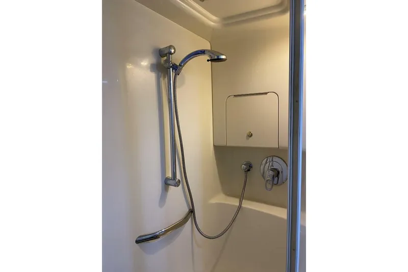 Slide: The Image of Shower area in 2001 Sea Ray 380 Sundancer yacht, featuring chrome fixtures. - 30