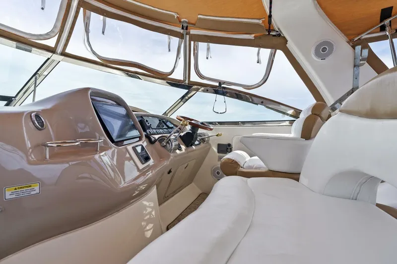 Slide: The Image of Interior of 2001 Sea Ray 380 Sundancer yacht with modern helm and seating. - 8