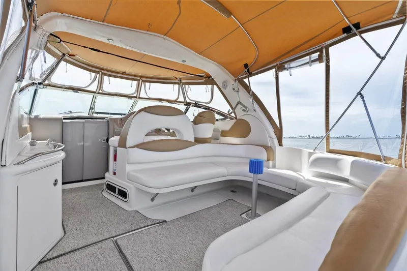 Slide: The Image of 2001 Sea Ray 380 Sundancer interior with spacious seating and panoramic windows. - 9
