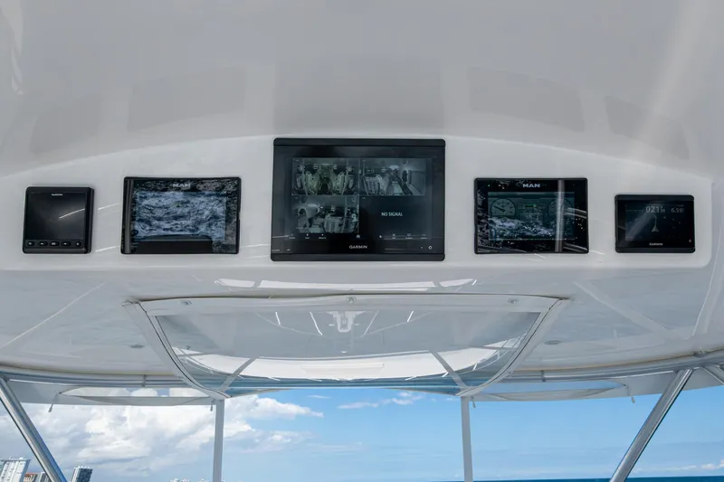 Slide: The Image of Viking boat dashboard with multiple Garmin displays and ocean view. - 10