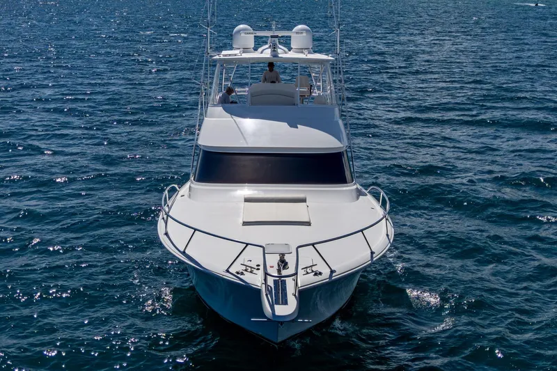 Slide: The Image of Front view of a Viking yacht cruising on open water under clear skies. - 2