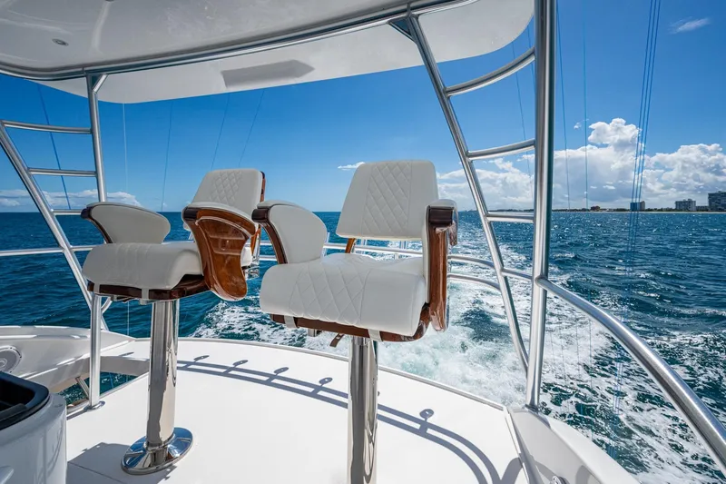 Slide: The Image of Luxury Viking yacht chairs overlooking ocean under clear blue sky. - 21