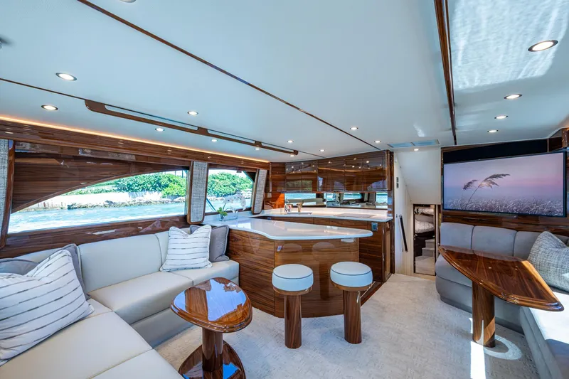 Slide: The Image of Luxurious Viking yacht interior with modern seating, wooden accents, and large windows. - 35