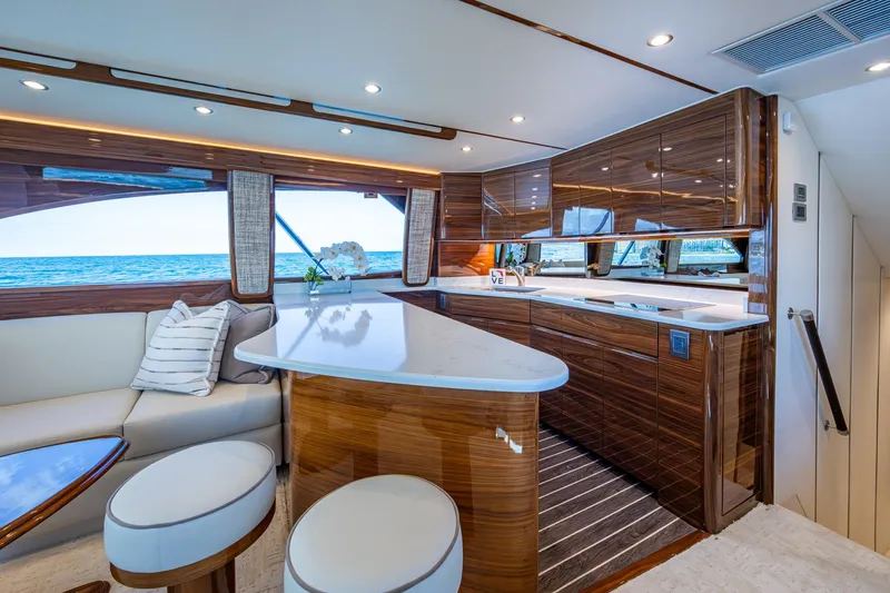 Slide: The Image of Luxurious Viking yacht interior with modern kitchen, ocean view, and elegant seating area. - 36