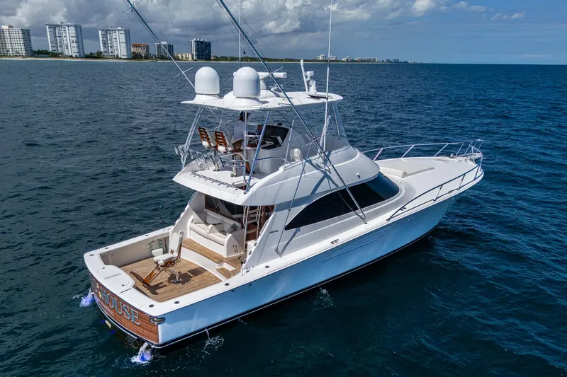 Slide: The Image of Luxury Viking yacht cruising on open ocean near coastal cityscape. - 4