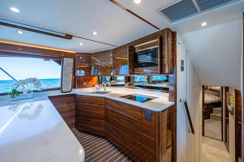 Slide: The Image of Luxurious Viking yacht interior with modern kitchen, sleek wood finishes, and ocean view. - 44