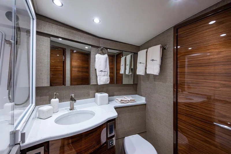 Slide: The Image of Luxurious Viking yacht bathroom with modern fixtures, elegant wood accents, and plush towels. - 47