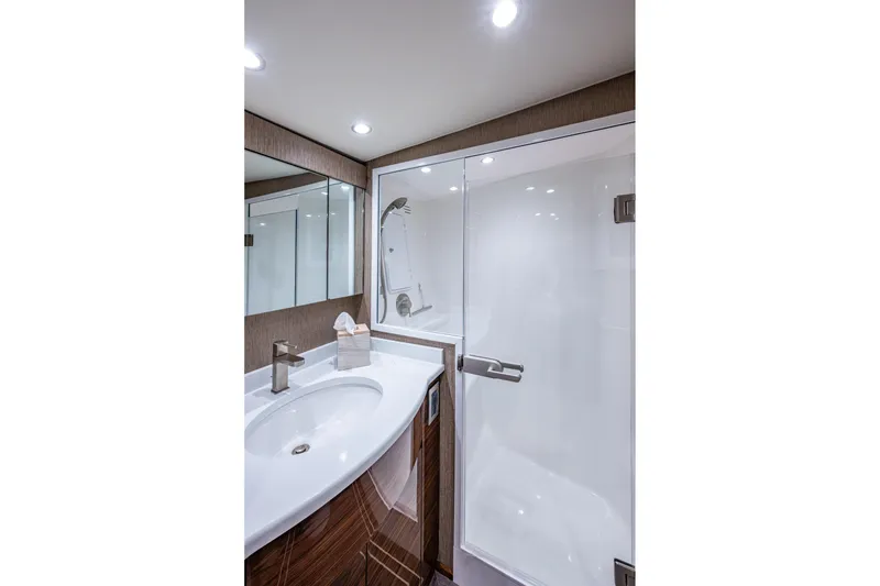 Slide: The Image of Modern Viking bathroom with sleek sink, glass shower, and elegant lighting. - 49
