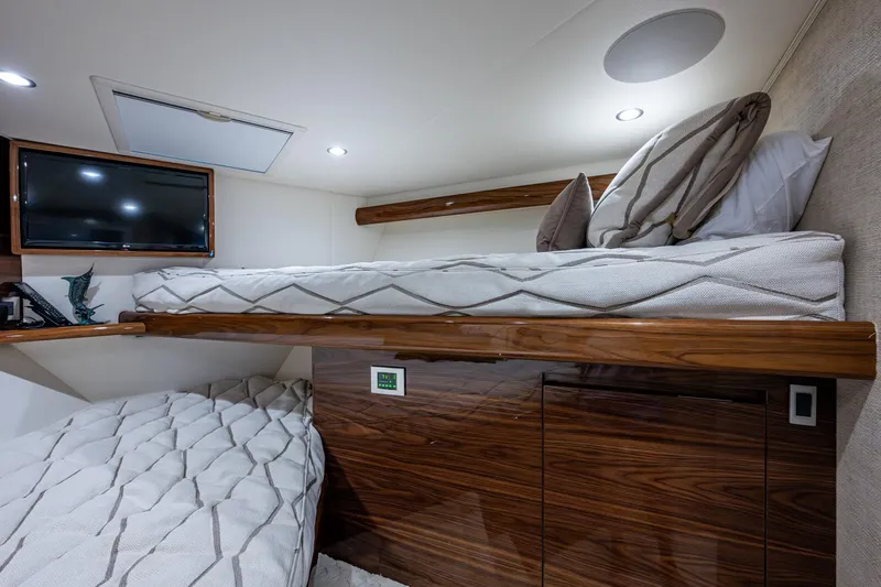 Slide: The Image of Luxurious Viking yacht cabin with wooden bunk beds and a mounted TV. - 53