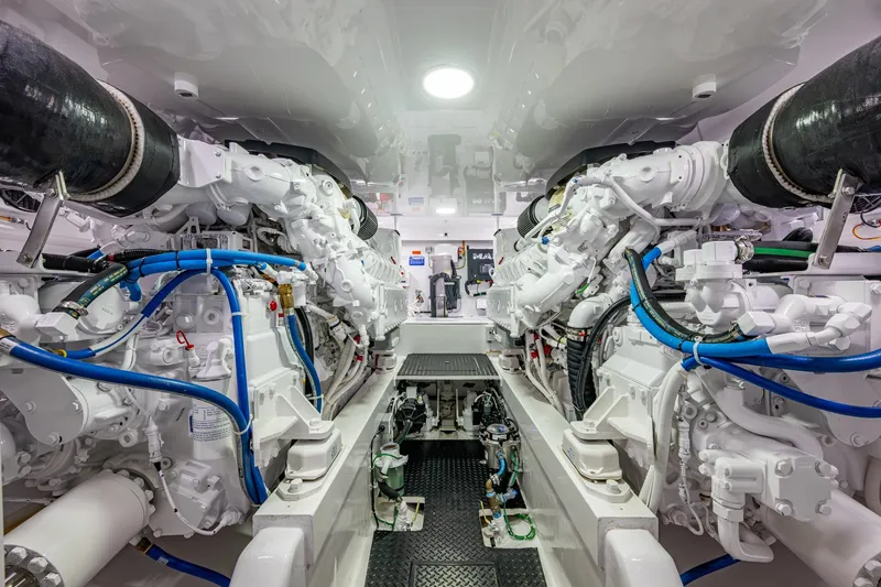 Slide: The Image of Engine room of a Viking yacht with complex machinery and blue hoses. - 57