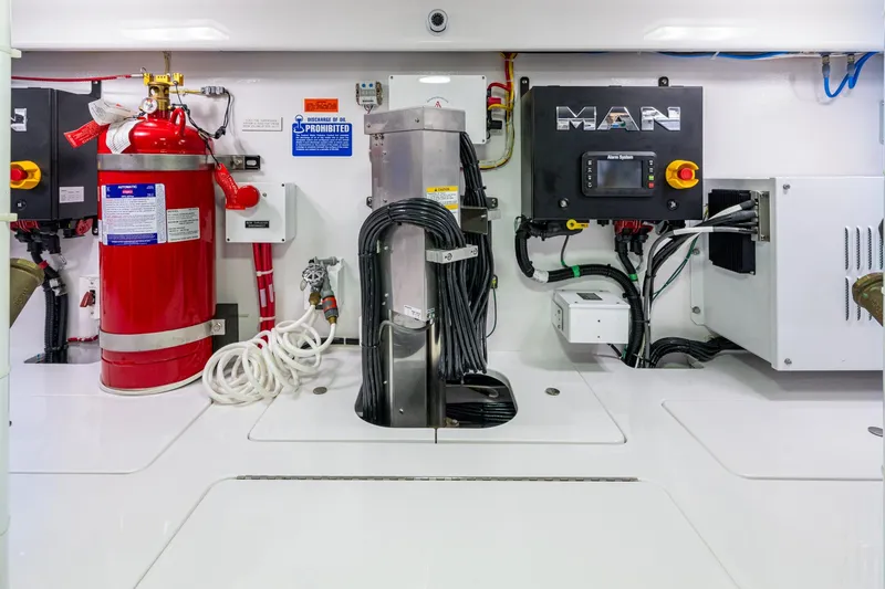 Slide: The Image of Engine room with Viking equipment, fire extinguisher, and MAN control system. - 61
