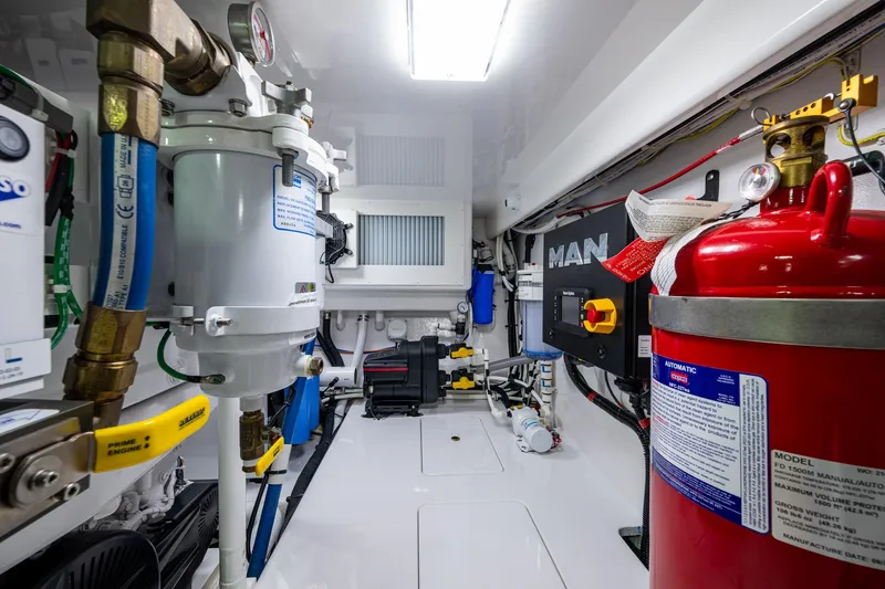 Slide: The Image of Engine room with Viking equipment, featuring fire extinguisher and various mechanical components. - 64