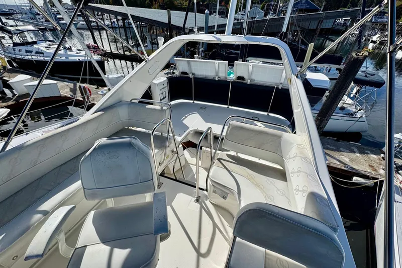Slide: The Image of 1998 Bayliner 3388 Command Bridge Motoryacht interior with seating, docked at marina. - 13