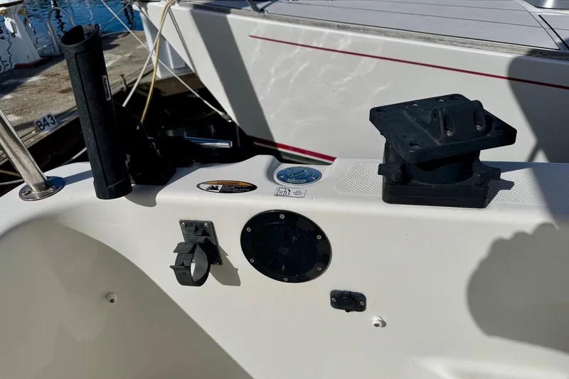 Slide: The Image of 1998 Bayliner 3388 Command Bridge Motoryacht deck with fishing rod holder and mount. - 14