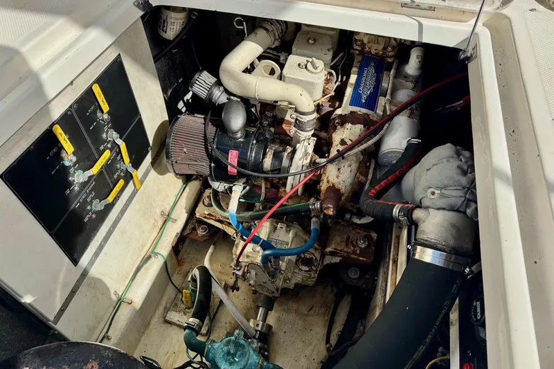 Slide: The Image of Engine compartment of a 1998 Bayliner 3388 Command Bridge Motoryacht, showing mechanical components. - 35
