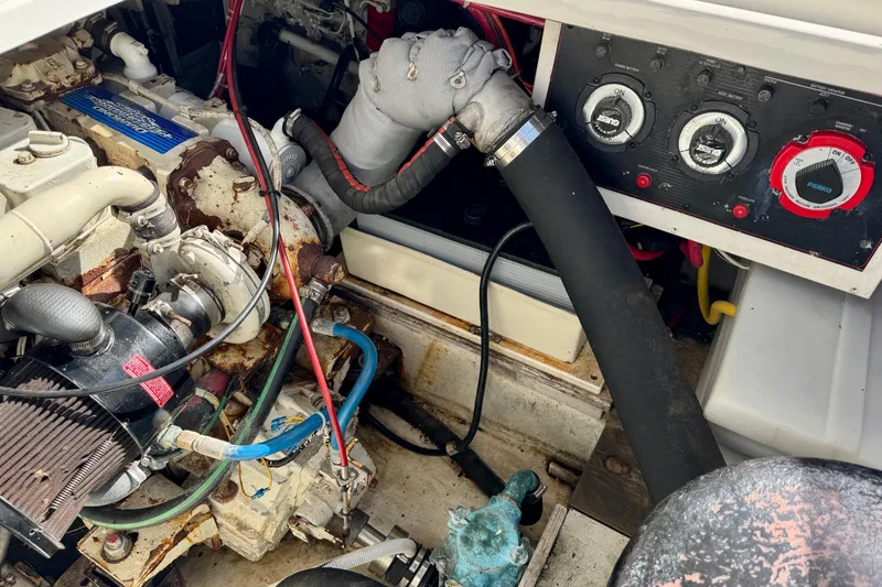 Slide: The Image of Engine compartment of a 1998 Bayliner 3388 Command Bridge Motoryacht, showing mechanical components. - 36
