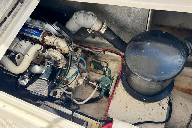 Slide: The Image of Engine compartment of a 1998 Bayliner 3388 Command Bridge Motoryacht, showing mechanical components. - 37