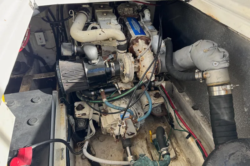 Slide: The Image of Engine compartment of a 1998 Bayliner 3388 Command Bridge Motoryacht, showing detailed components. - 38