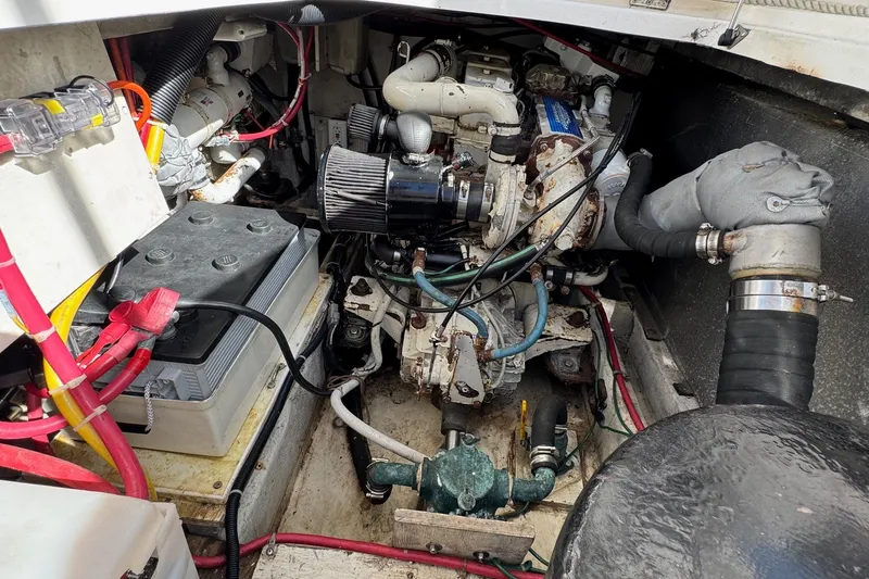 Slide: The Image of Engine compartment of a 1998 Bayliner 3388 Command Bridge Motoryacht, showing battery and wiring. - 39