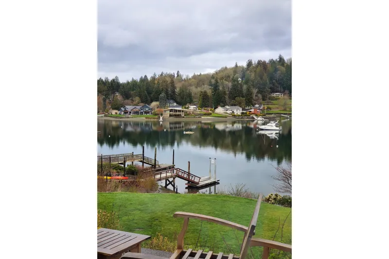 Slide: The Image of Scenic lakeside view with a 1998 Bayliner 3388 Command Bridge Motoryacht docked. - 45