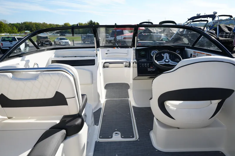 Slide: The Image of 2023 Bayliner VR5 Bowrider I/O interior with steering wheel and seating. - 10
