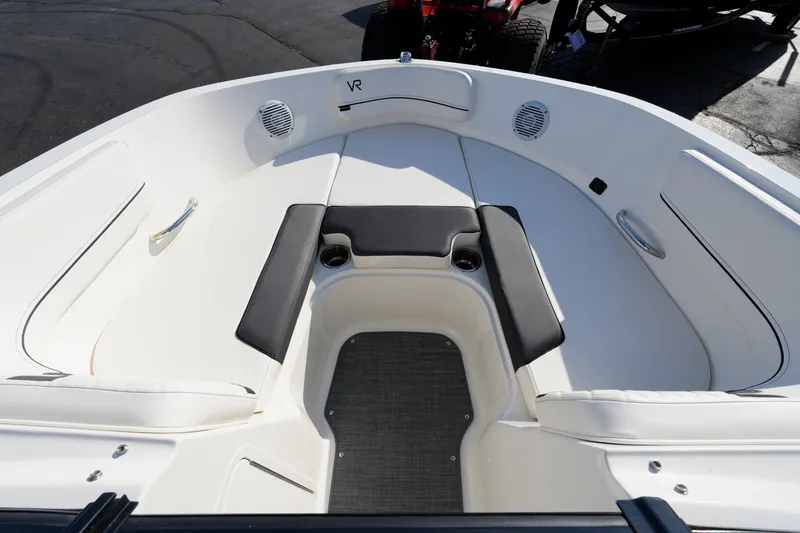 Slide: The Image of 2023 Bayliner VR5 Bowrider I/O boat interior with cushioned seating and cup holders. - 7