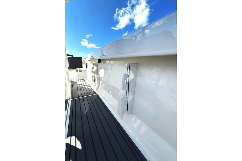 Slide: The Image of 2023 Bayliner Trophy T22CC boat deck with clear blue sky background. - 19