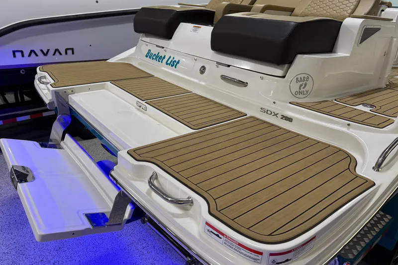 Slide: The Image of 2023 Sea Ray SDX 290 boat with teak deck and comfortable seating. - 10