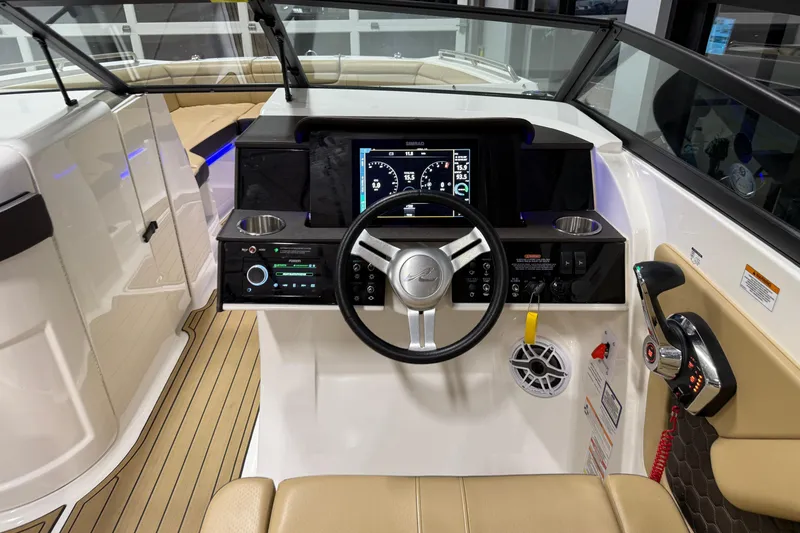 Slide: The Image of 2023 Sea Ray SDX 290 helm with modern controls and navigation display. - 19