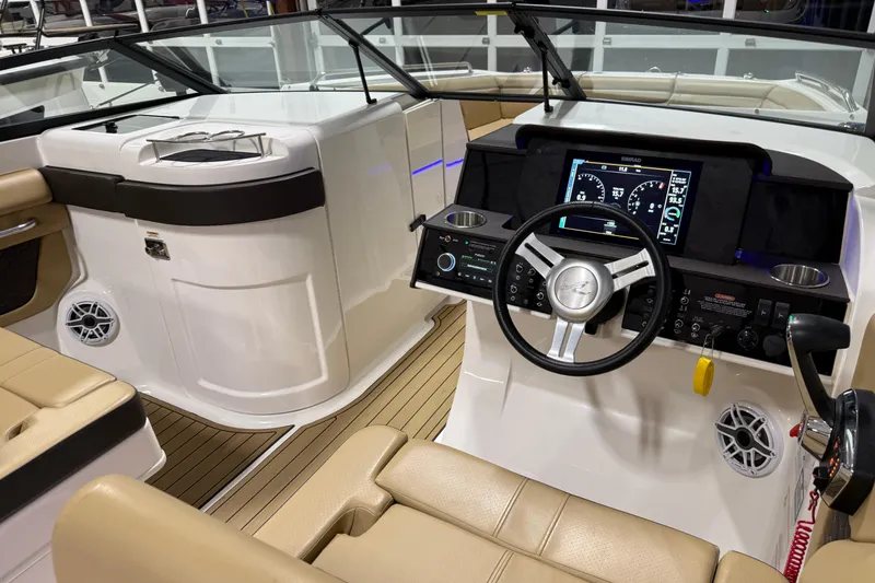 Slide: The Image of 2023 Sea Ray SDX 290 boat interior with modern dashboard and steering wheel. - 20