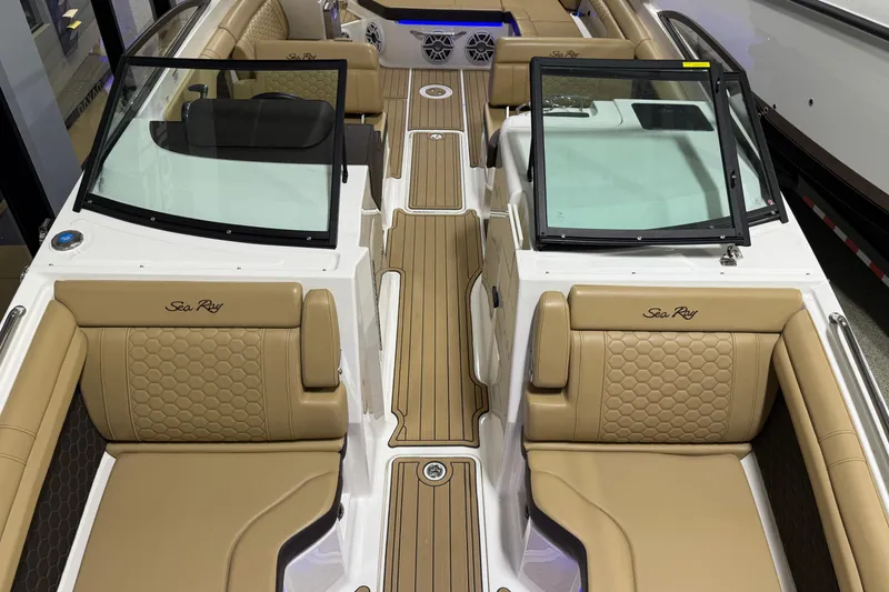 Slide: The Image of 2023 Sea Ray SDX 290 boat interior with tan leather seating and sleek design. - 22