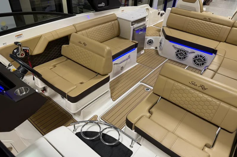 Slide: The Image of Luxurious interior of 2023 Sea Ray SDX 290 boat with tan seating and modern amenities. - 27