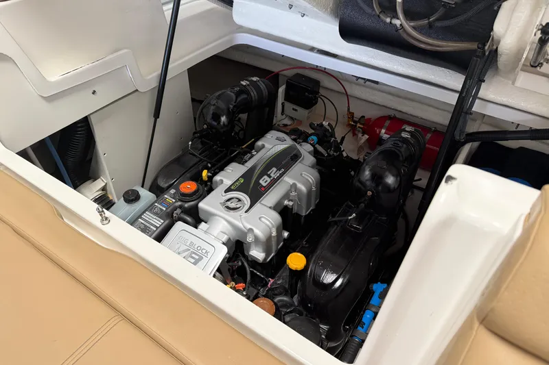 Slide: The Image of Engine compartment of 2023 Sea Ray SDX 290 boat, featuring a powerful engine setup. - 29