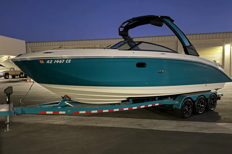 Slide: The Image of 2023 Sea Ray SDX 290 boat on trailer, parked at night. - 30