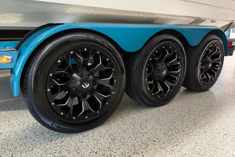 Slide: The Image of Triple axle trailer with black alloy wheels for 2023 Sea Ray SDX 290 boat. - 4