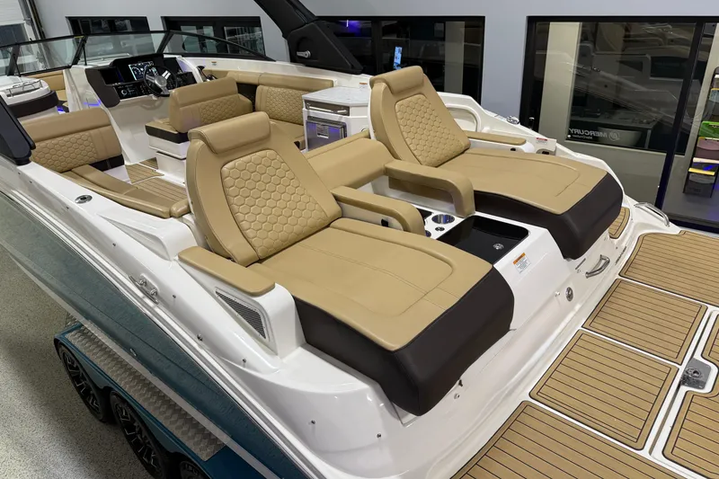Slide: The Image of 2023 Sea Ray SDX 290 boat interior with luxurious tan seating and modern dashboard. - 8