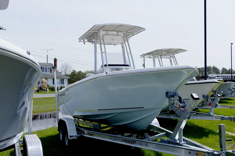 Slide: The Image of 2026 Key West 203 FS boat on trailer, displayed outdoors. - 12